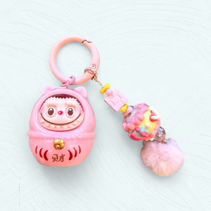 Labubu Daruma rose avec clochette assortie