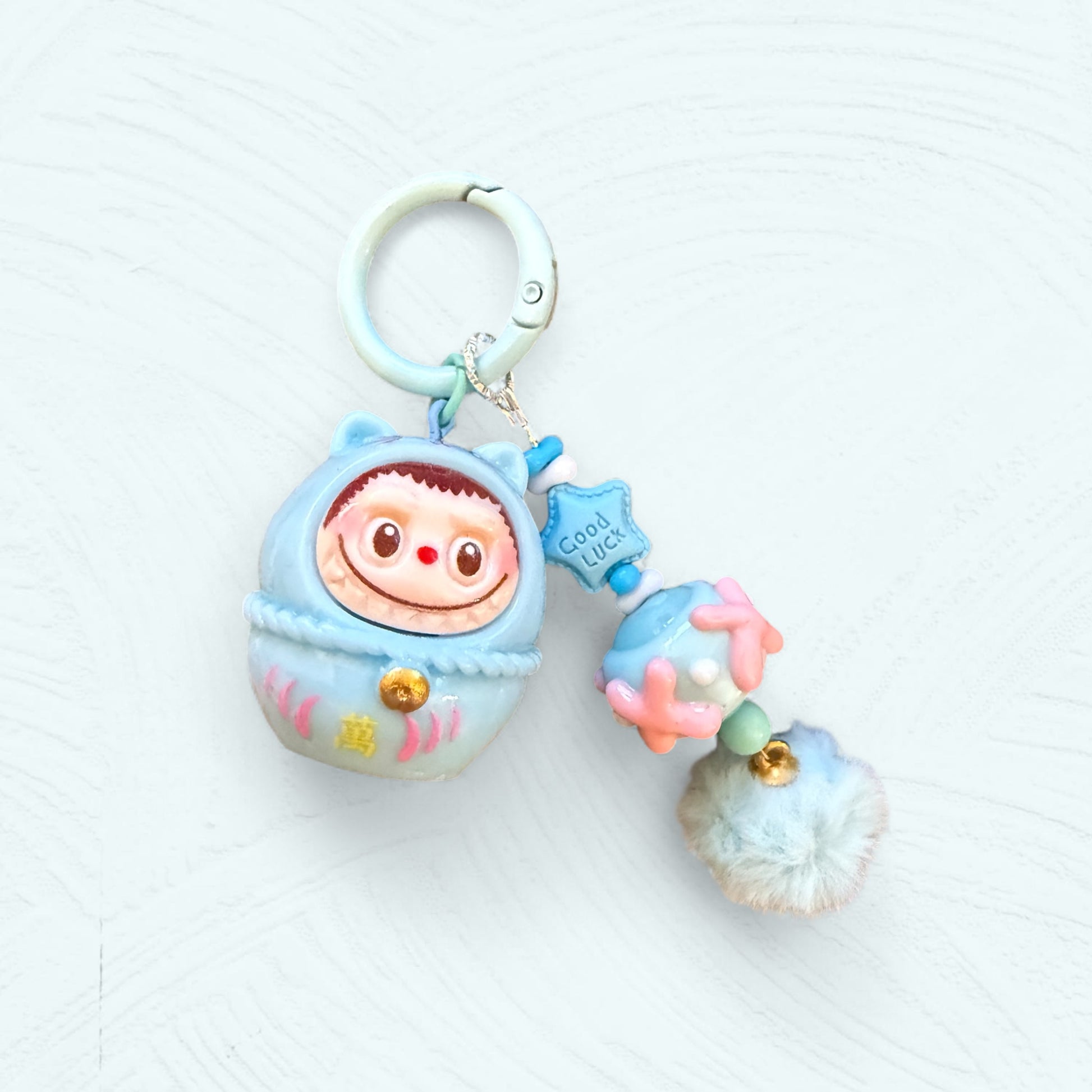 Labubu Daruma bleu ciel avec détails dorés