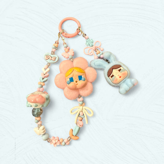 Bijou de sac Crybaby double : fleur rose et lapin bleu ciel